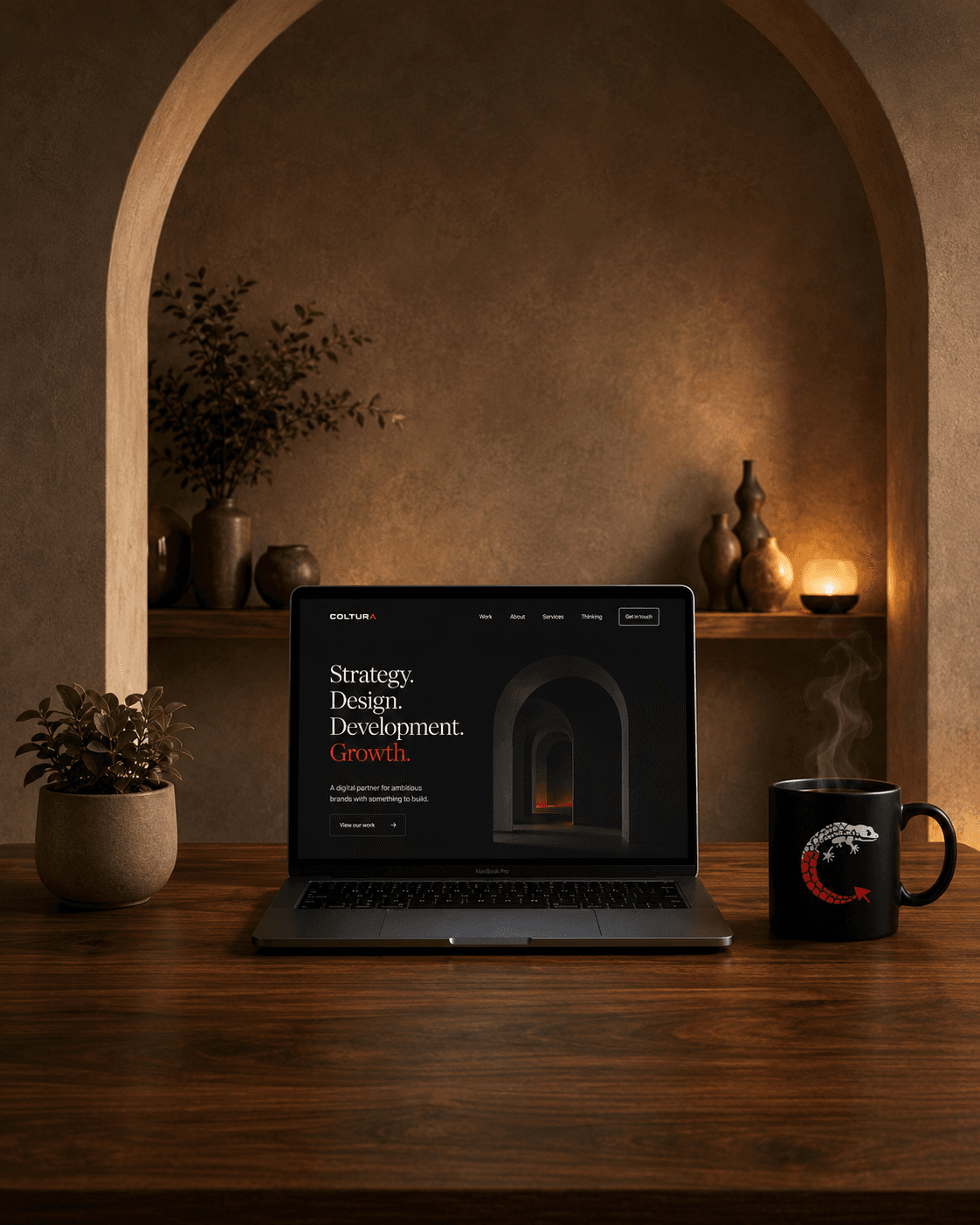 A Coltura website on a laptop in a warm, dusk-lit plaster archway